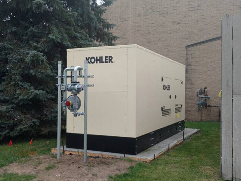 An installed whole-home generator next to a small office building